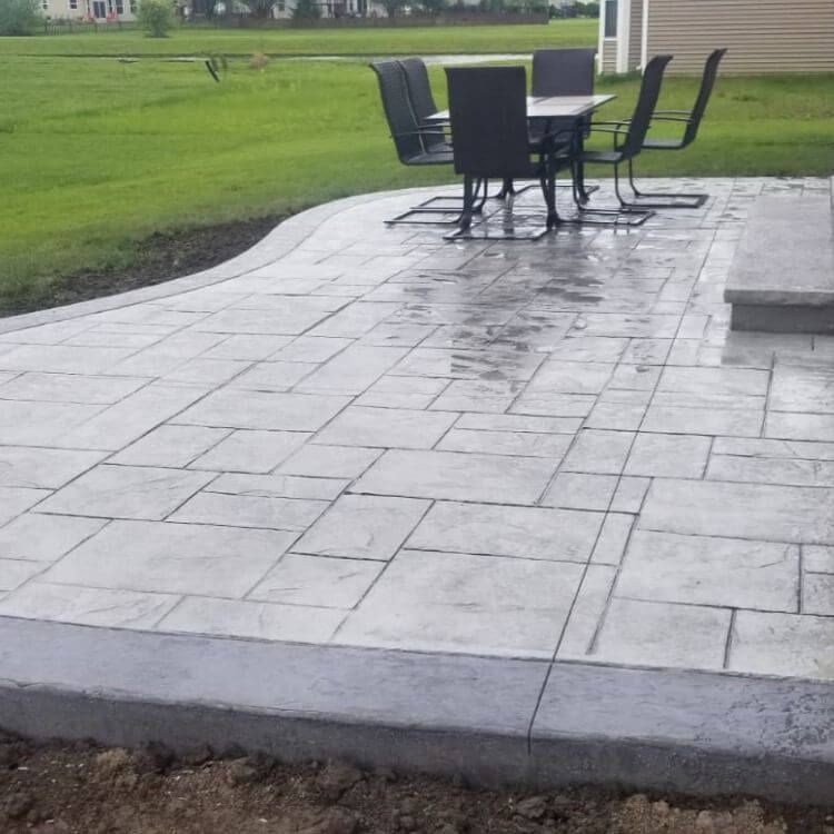 A gray toned stamped concrete patio